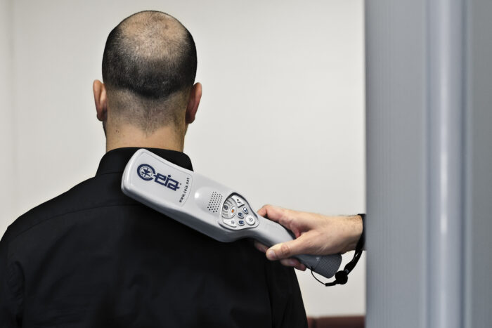 Image showing the handheld metal detector in use